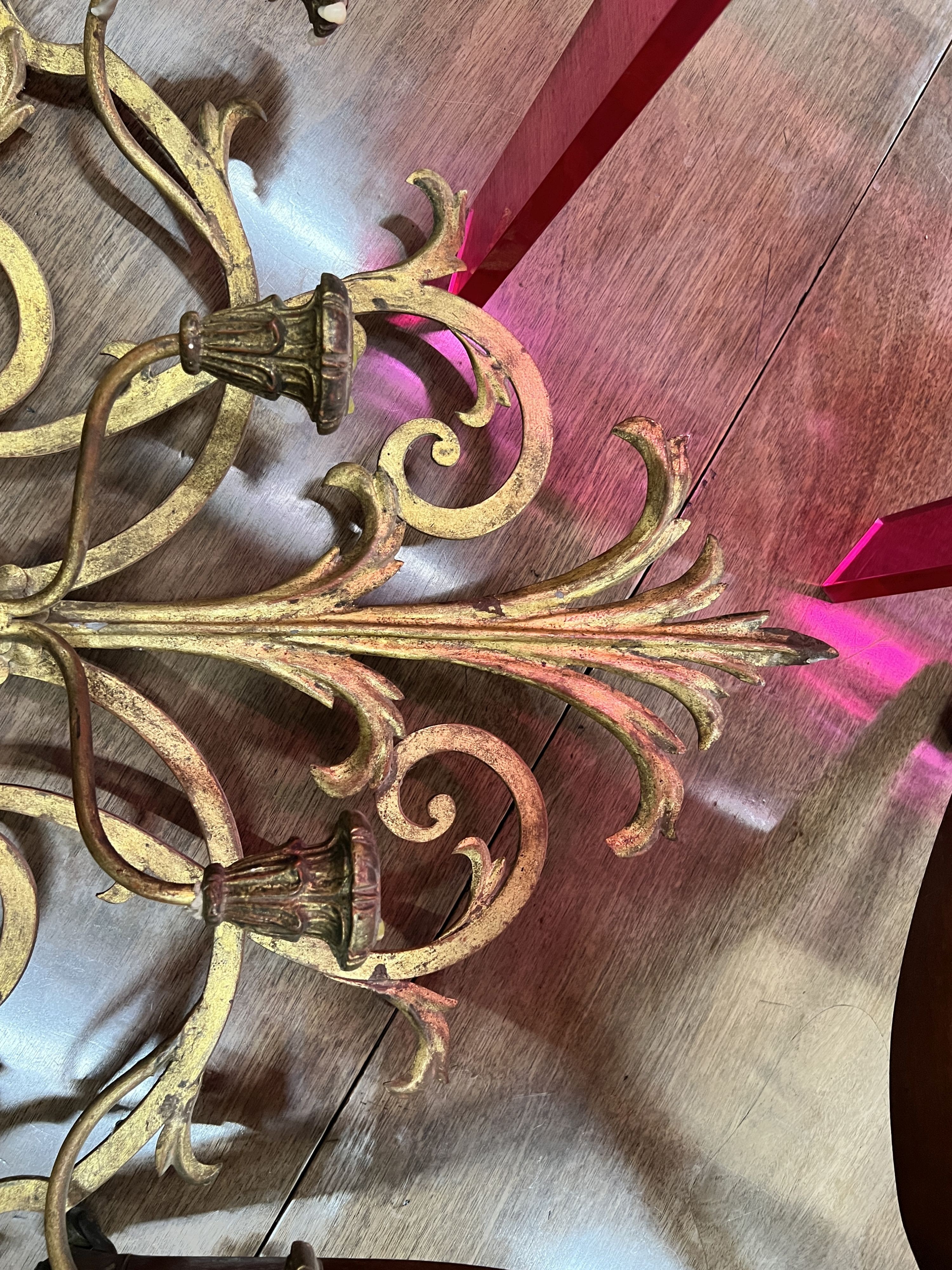A painted scroll metal six branch wall sconce, width 100cm, height 66cm